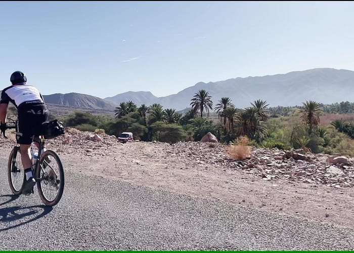 Cycling the atlas mountains and enjoying a breathtaking panoramic view from a summit in the Atlas Mountains, Morocco